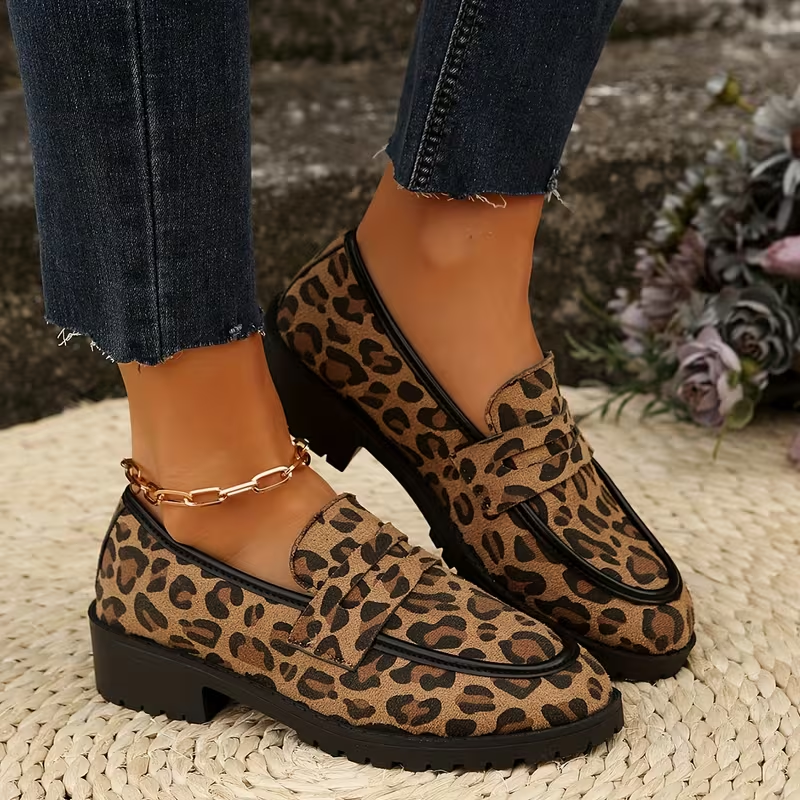Tui leopard loafer side view showing the block heel